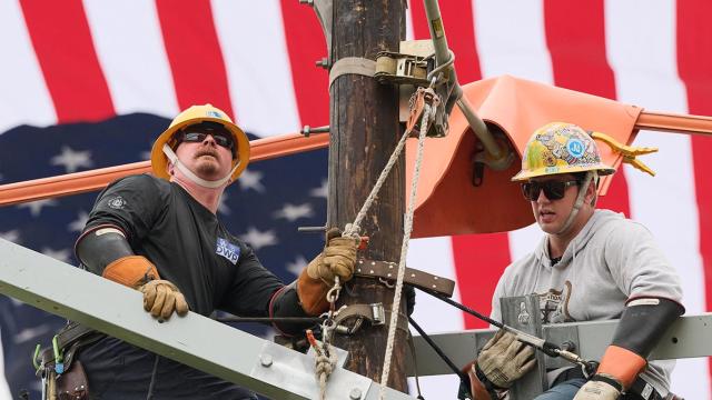 lineman on utility pole