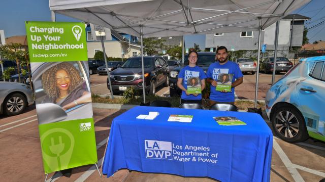 Two employees at an LADWP booth at an event
