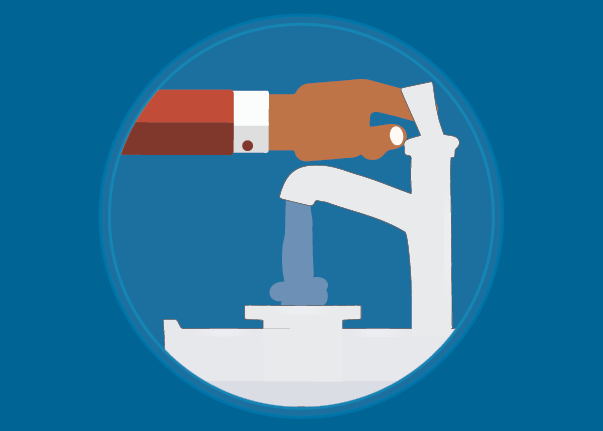 A hand reaches out to turn on a water faucet.