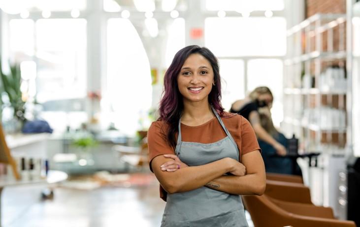 Woman standing with arms crossed.
