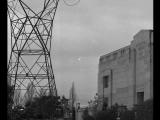 Power transmission tower next to a building