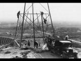 Men constructing power transmission tower