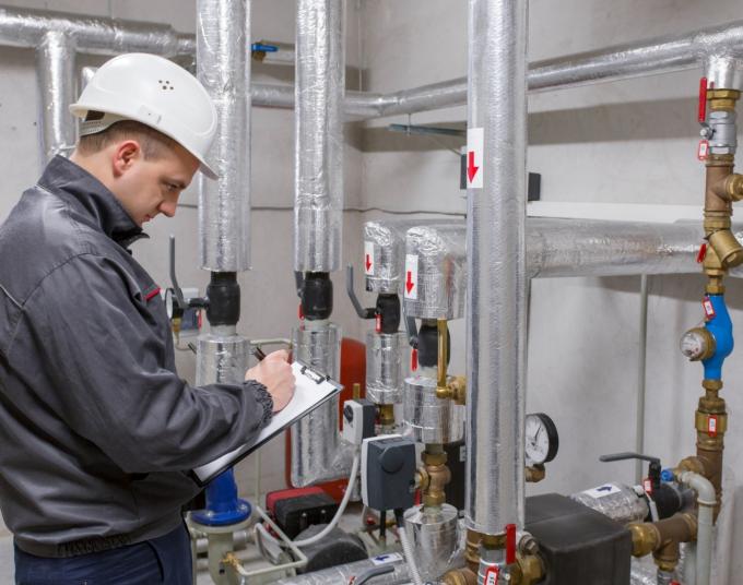 An energy auditor checks the system.