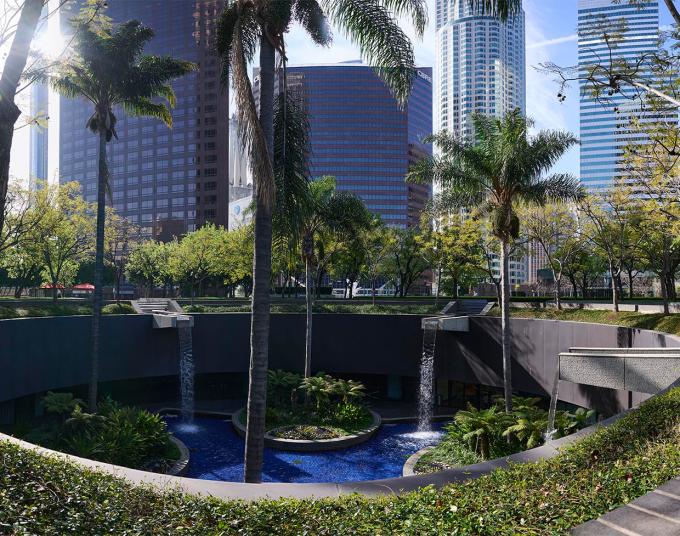 Water from a downtown water feature cascades into a subterranean pool.