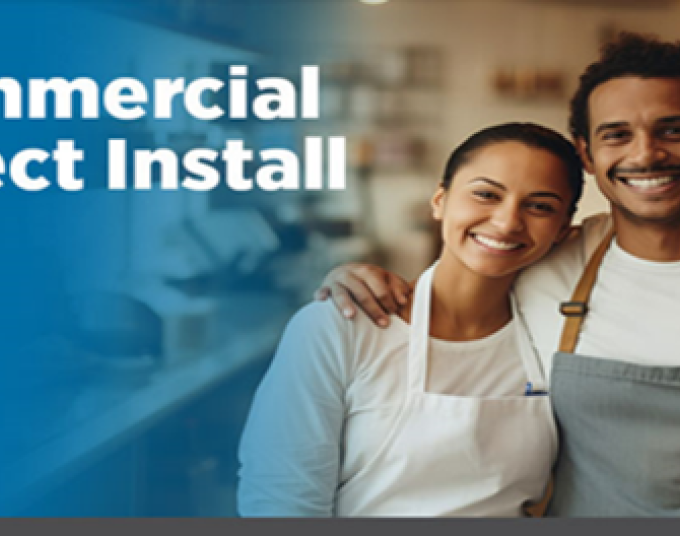 A man with his hand wrapped around a woman’s shoulder. Both are wearing aprons and smiling. The white text in the upper left-hand corner reads Commercial Direct Install.