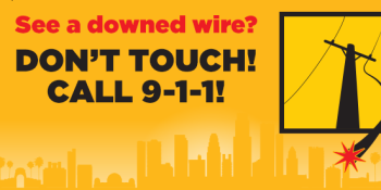 Power pole with a downed wire on a yellow city landscape background. Red text reads, “See a downed wire?” Black text reads, “Don’t touch! Call 9-1-1!” 