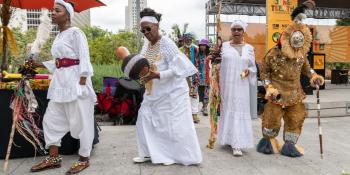 People singing and dancing at a Juneteenth event.